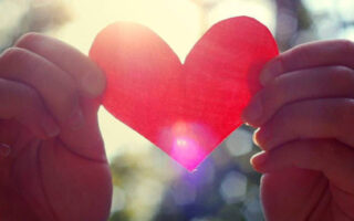 HD wallpaper Valentines Day love heart in hands sun raysvalentines day phone wallpaper