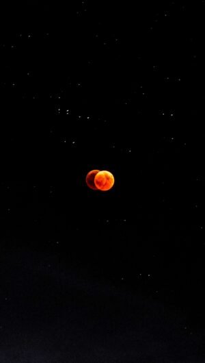 Amoled Red Moon Eclipse 4K iPhone 13 Wallpaper scaled